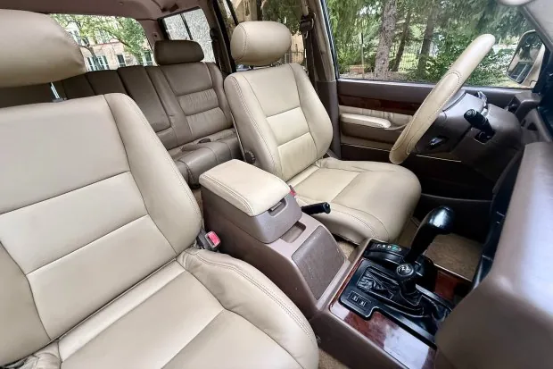Interior of 1997 Lexus LX450 with beige leather seats.