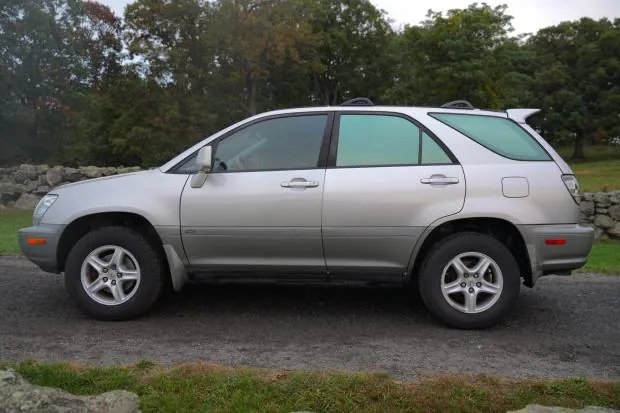 2002 Lexus RX300 in silver parked outdoors.