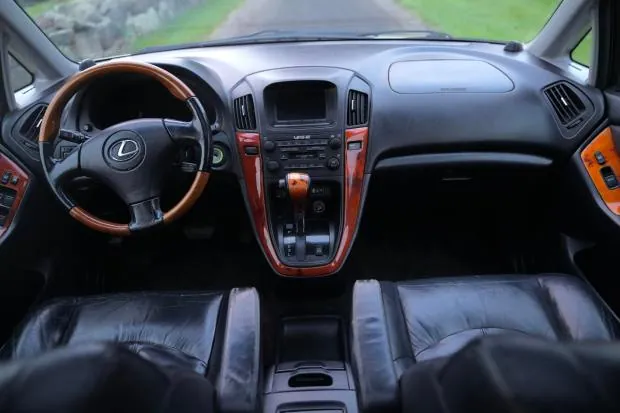 Interior of 2002 Lexus RX300 with black leather seats.
