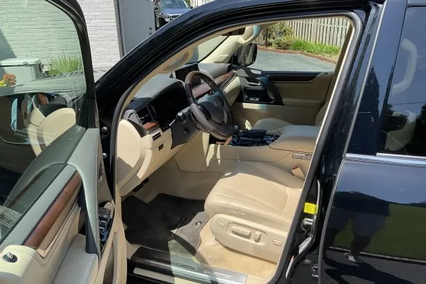 Interior of 2017 Lexus LX570 with beige leather seats.