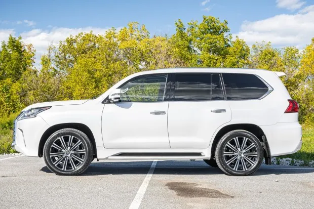 Side view of white 2018 Lexus LX570 SUV.