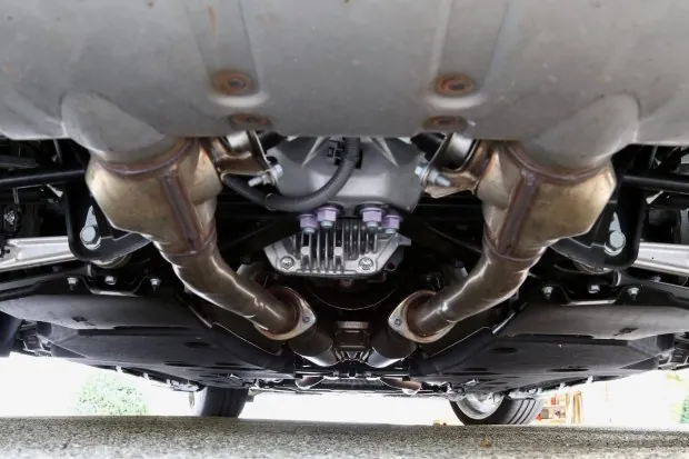 Underbody view of Lexus LC500 exhaust system.