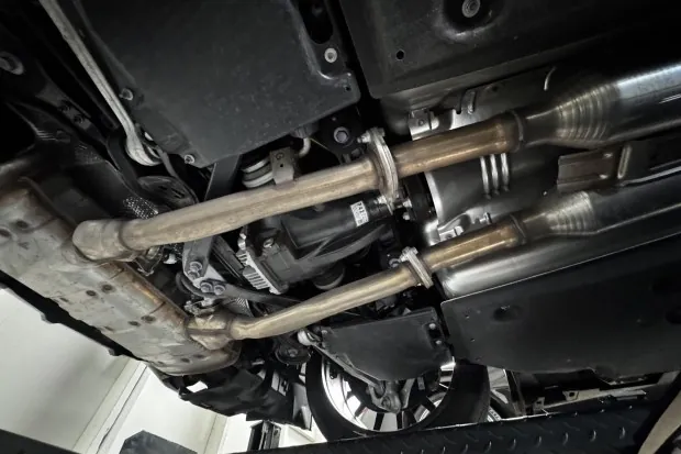 Underbody view of Lexus LC500 exhaust system.