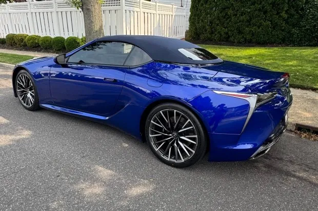 2026 Lexus LC500 Convertible in blue parked on street.