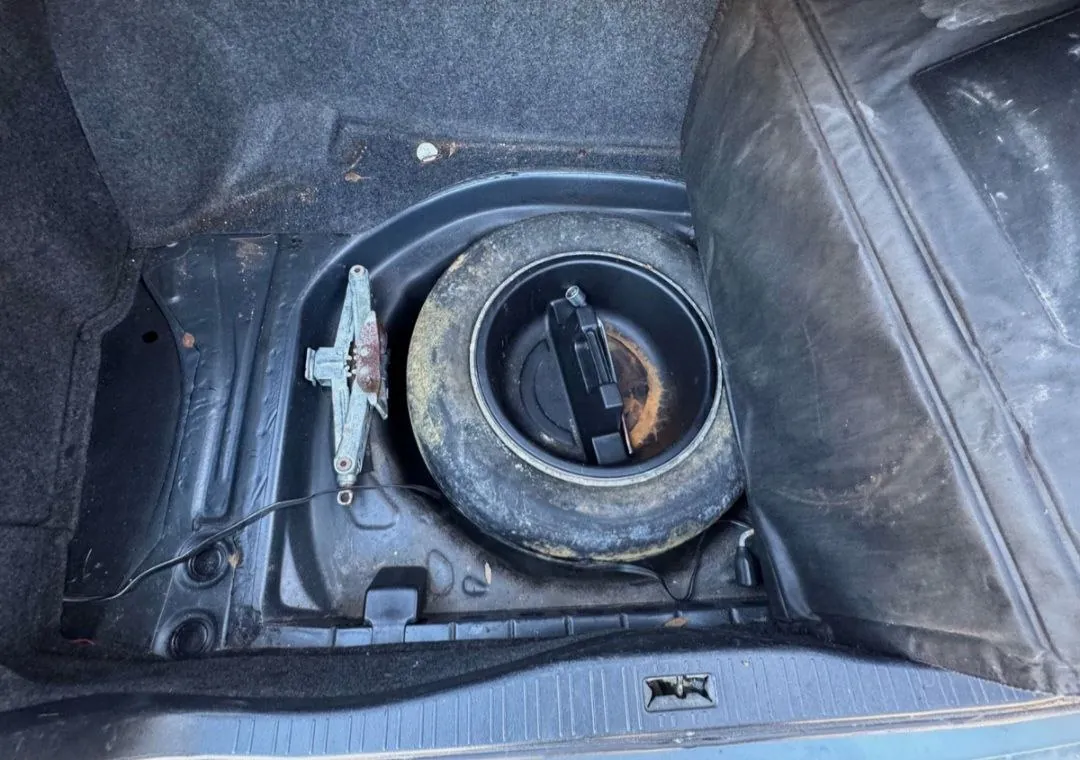 Trunk of 1990 Lexus LS400 with spare tire