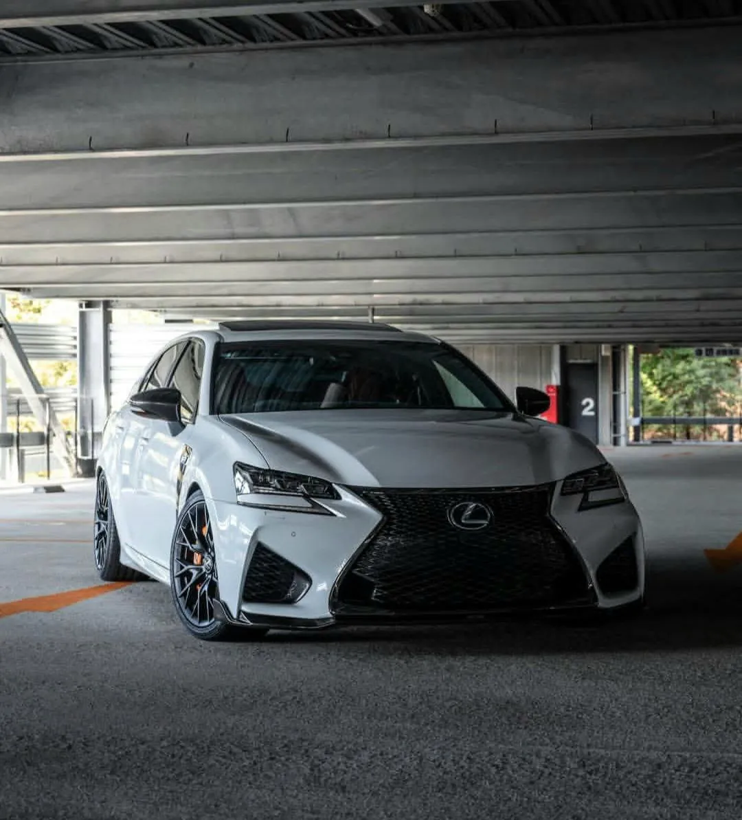 White Lexus GS in parking garage