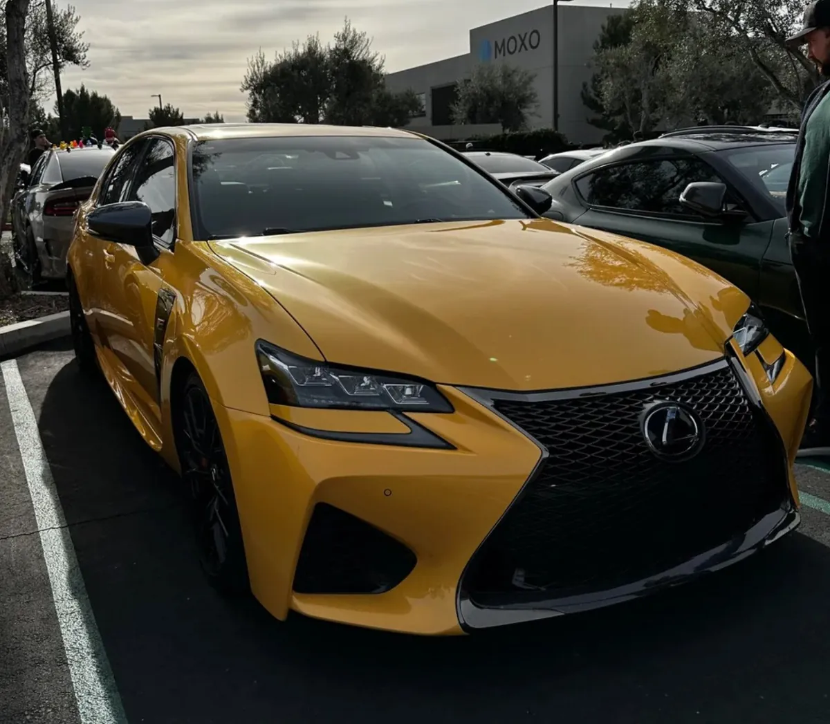 Yellow Lexus GSF parked outdoors.