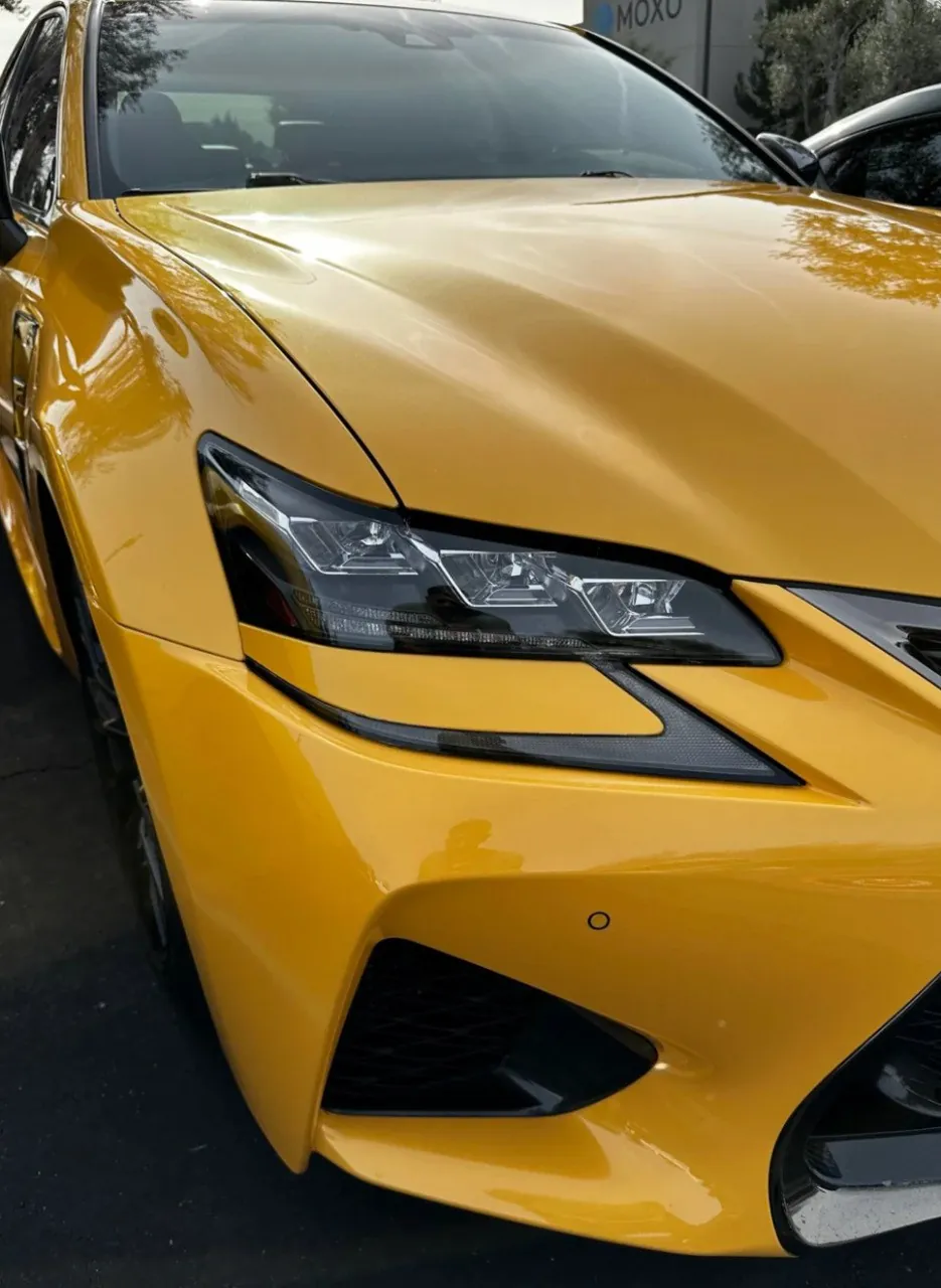 Close-up of yellow Lexus GSF front view.