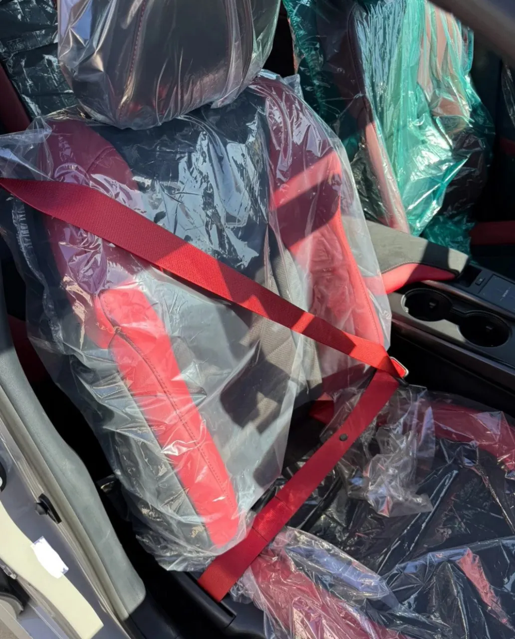 Lexus IS500 interior with red seatbelt.