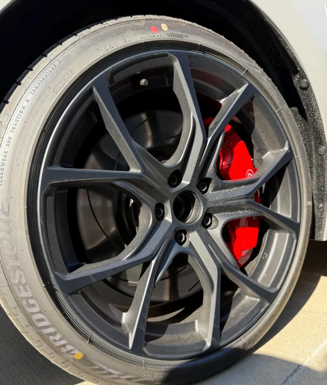 Close-up of Lexus IS500 wheel and brake caliper.