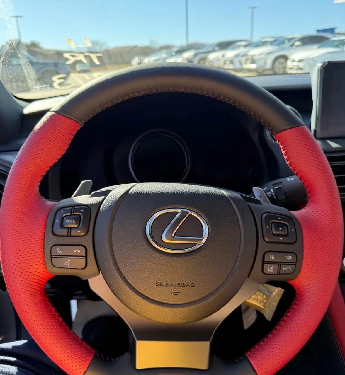 Lexus IS500 steering wheel with red accents.