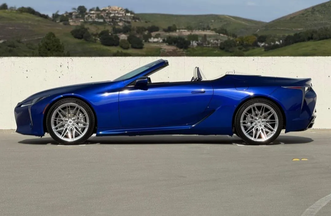 Blue Lexus LC500 convertible parked outdoors.