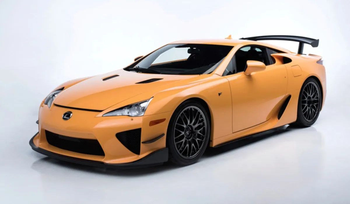 Orange Lexus LFA sports car on display.