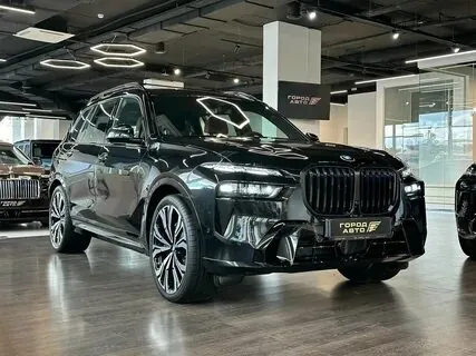 Black BMW X7 in showroom.
