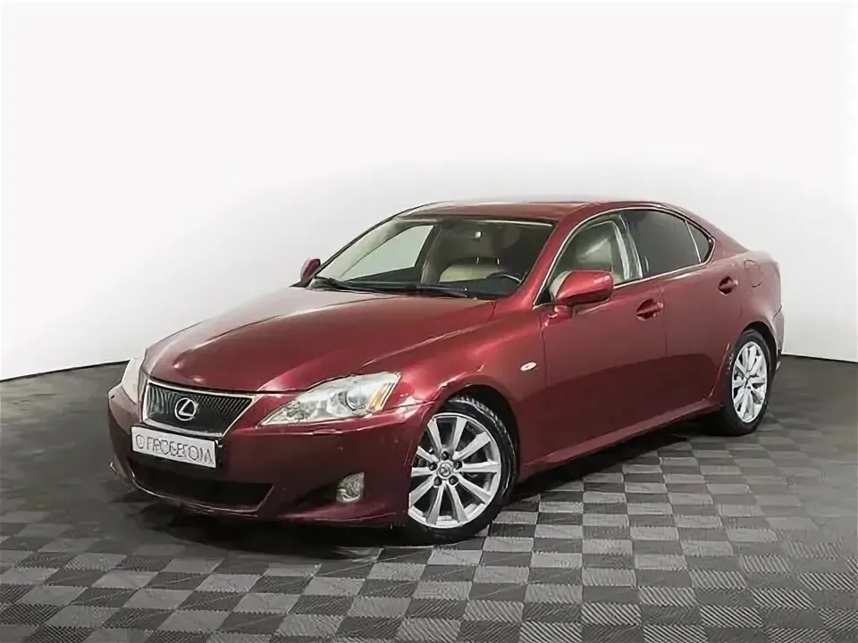 Red Lexus IS250 in a showroom.